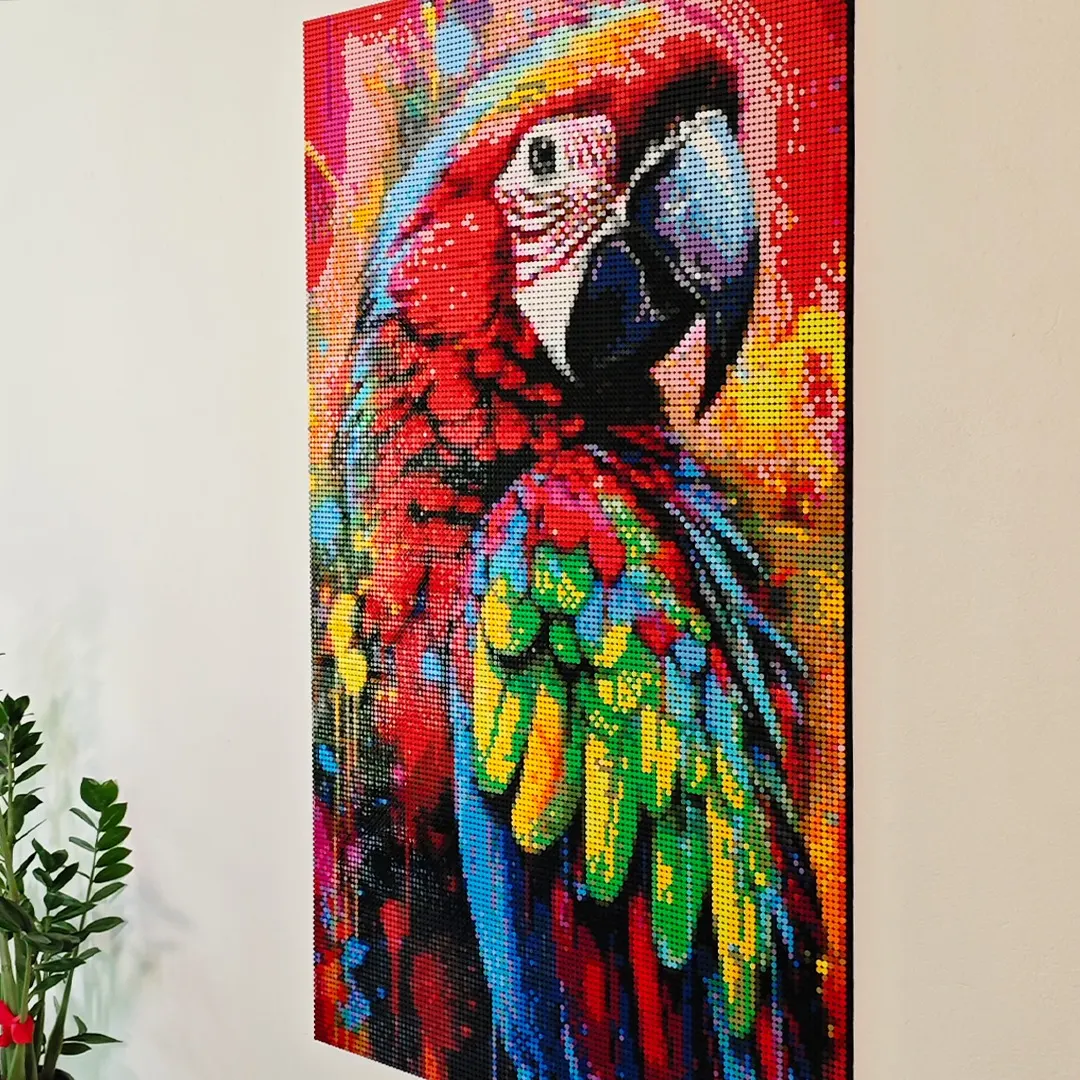 A pixel art parrot made of round tiles, hanging on a white wall